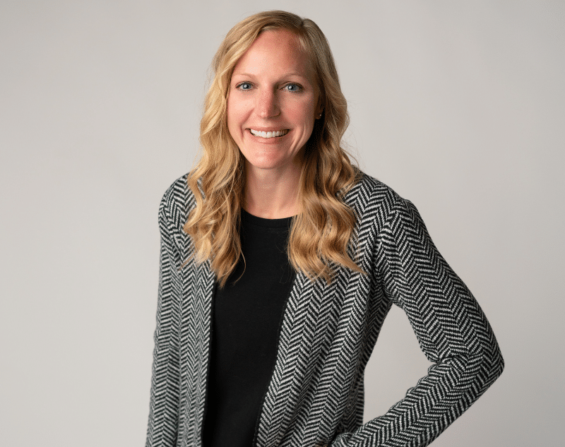 Female orthodontist smiling in clinic | Shift Orthodontics in Brighton, MI